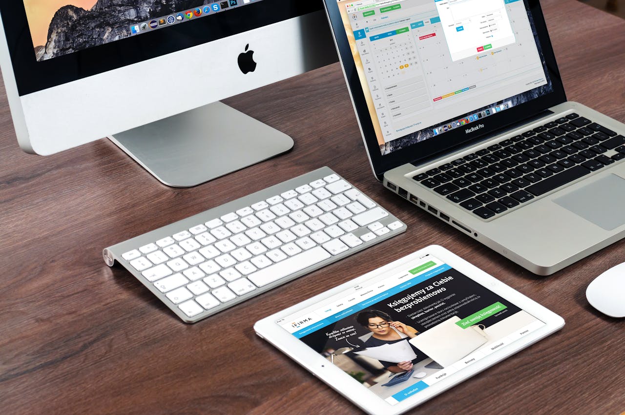 Mastering the First Impression: Your intriguing post title goes here A sleek office desk setup featuring Apple devices: iMac, MacBook, and iPad.